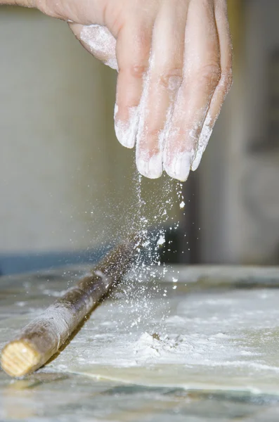 Chef makes and prepares pastry in a bakery kitchen. Adding flour. — Stock Photo, Image