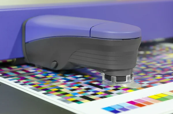 Spectrophotometer measurment of color patches on Test Arch, print plant prepress department — Stock Photo, Image