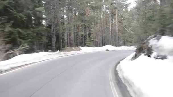 Drive a curve on a snow winter road POV — Stock Video