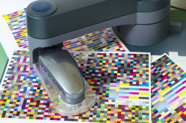 Spectrophotometer robot measures color patches on Test Arch clipart