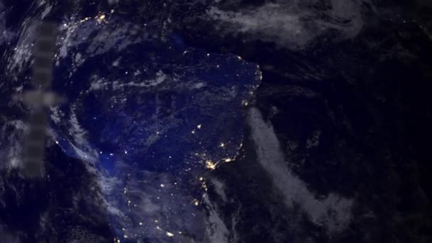 Satellite de télécommunication au-dessus de l'Amérique du Sud partie de la terre 