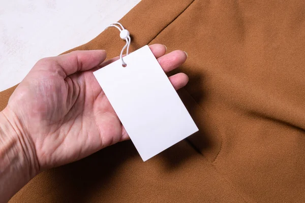 Etiqueta Papel Vestuário Marrom Etiqueta Tecido — Fotografia de Stock
