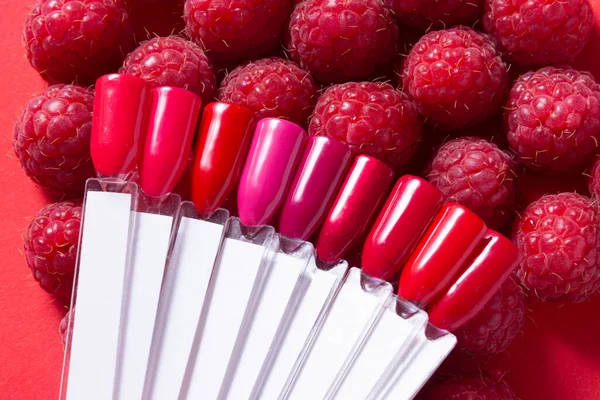 Nail polish samples recorated with red raspberry