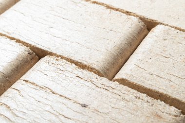 Isıtma ve dokulu arka plan için bir sürü ahşap briket.