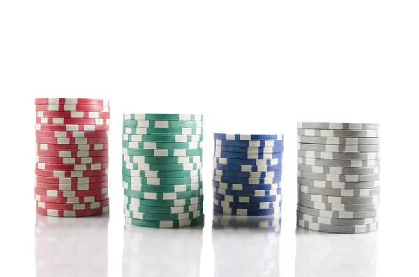 Stack of poker chips. Red, blue,green, and grey chips over white isolated background. — Stock Photo, Image