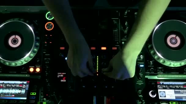 Top view of a deejay mixing music in Night Club Disco Party. — Video Stock