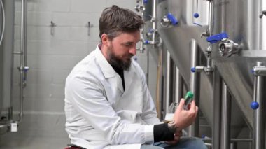 Person with disability who uses a wheelchair working at craft beer factory.