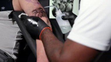 Body art at the tattoo studio