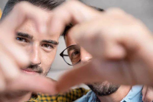 Young Gay Couple Smiling Confident Doing Heart Symbol Hands Home — стоковое фото