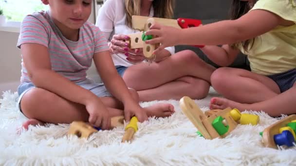 Mother Children Playing Together Colorful Construction Toys Carpet Floor High — ストック動画