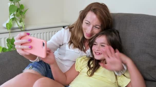 Happy Mother Her Daughter Making Video Call Father Relatives Sofa — Vídeos de Stock