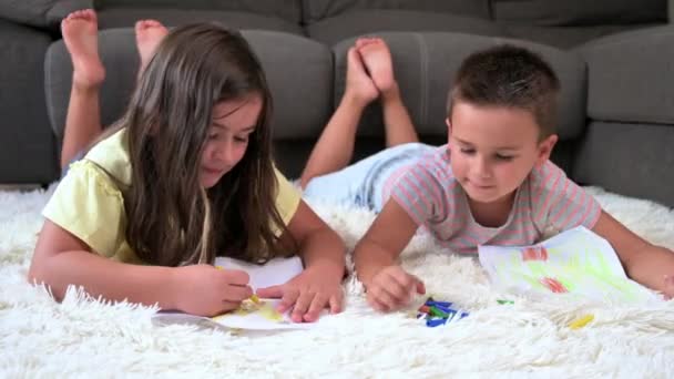 Playful Adorable Girl Lying Carpet Younger Brother Drawing Pictures Together — Αρχείο Βίντεο