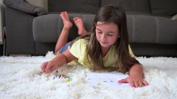 Cheerful Little Girl Lying Floor Drawing High Quality Footage — Stok video