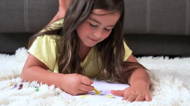 Cheerful Little Girl Lying Floor Drawing High Quality Footage — Wideo stockowe