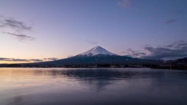 Amazing Timelapse beautiful sunrise over mount fuji reflect on water at early spring morning at kawaguchiko lake japan