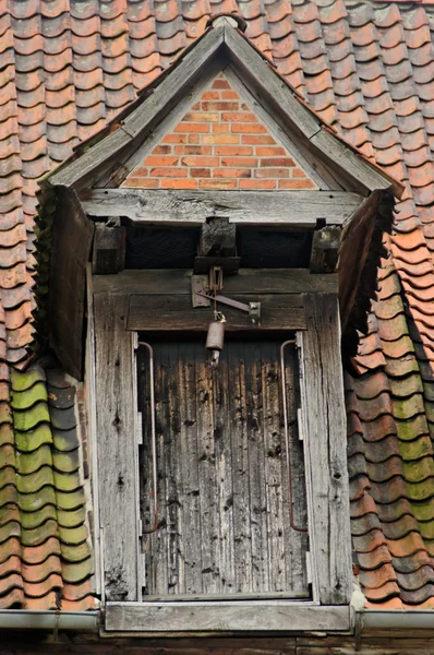 Dormer with wood door and pulley — Stock Photo, Image
