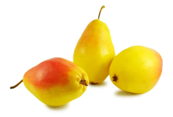 Kolme keltaista päärynää — kuvapankkivalokuva