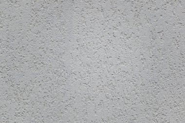 Duvarın beyaz kaplamalı küçük bir tahıllı bölgesi. Doku veya arkaplan