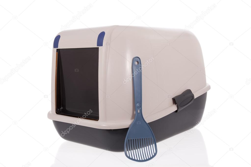 Closed cat litter box with scoop isolated on white background Stock
