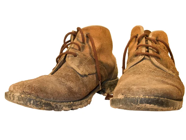 Старые и грязные изношенные рабочие ботинки — стоковое фото