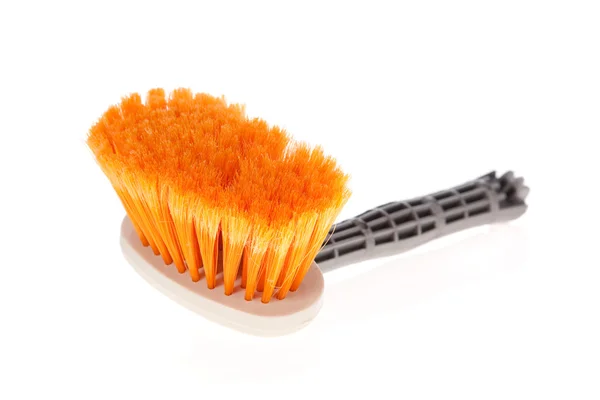 Paintbrush or small broom used for whitewashing walls or sweeping on white — Stock Photo, Image