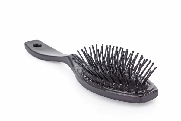 Escova de cabelo preta isolada em um fundo branco — Fotografia de Stock