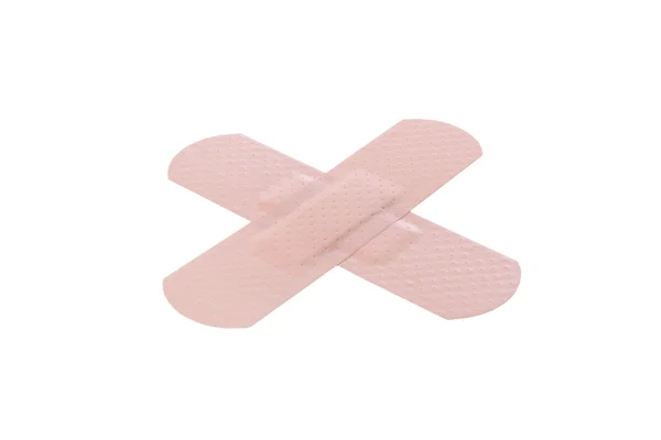 Bandaids üzerinde beyaz izole ile yapılan x — Stok fotoğraf