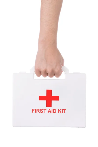 Hand holding a first aid kit isolated on white background — Stock Photo, Image