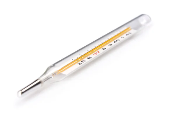 Termometro tradizionale con focus sulla temperatura della febbre leggera — Foto Stock