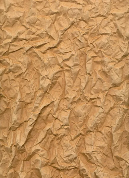 Folha muito enrugada de papel marrom com textura áspera — Fotografia de Stock