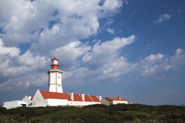 18th century Espichel Cape Lighthouse in Sesimbra, Portugal. clipart