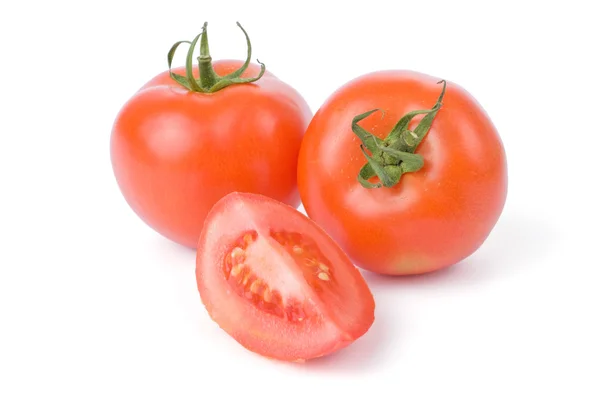 Ripe tomatoes isolated on a white background with one cut in a quarter — Stock Photo, Image