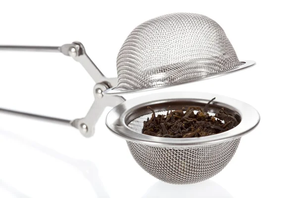 Close up of a Tea infuser with Green Tea leaves — Stock Photo, Image