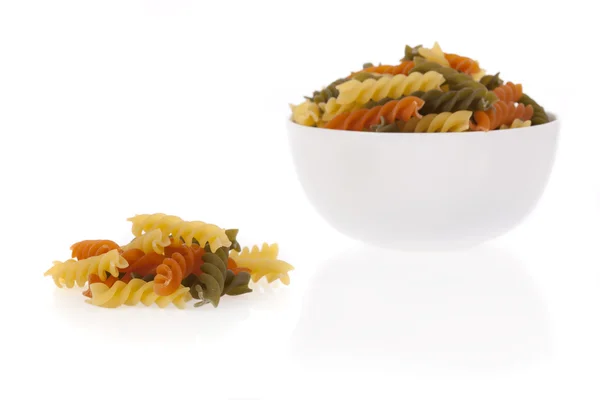 Tricolore fusilli pasta in a bowl isolated on a white background — Stock Photo, Image