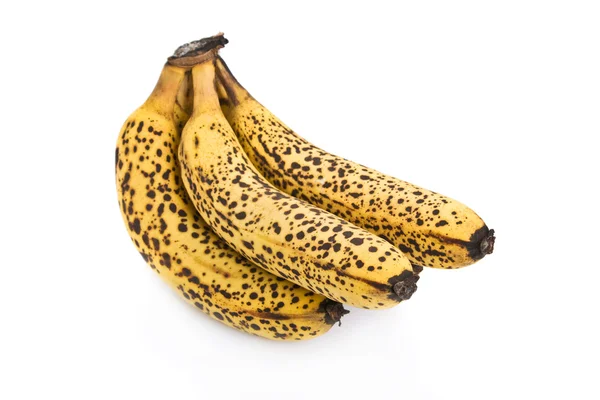 Kluster av över mogna bananer isolerad på vit bakgrund.. — Stockfoto