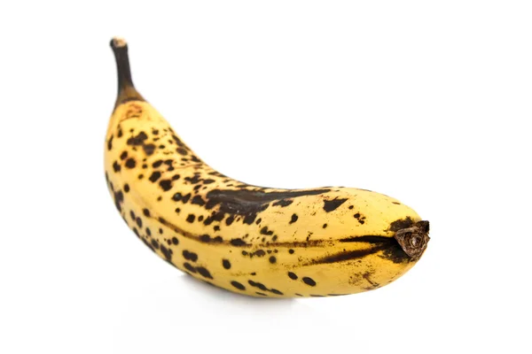 Над спелым бананом на белом фоне — стоковое фото