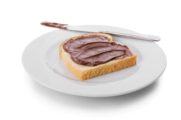 Fetta di pane ricoperta con crema di nocciole e cioccolato — Foto Stock