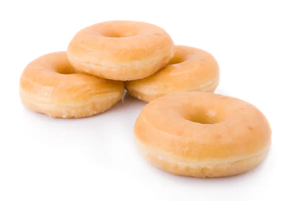 Чотири пончики або пончики ізольовані на білому — стокове фото