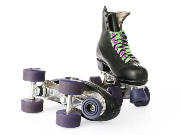 Retro patins de rolo isolado no fundo branco — Fotografia de Stock