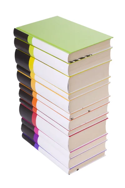 Купа різнокольорових книг ізольовані на білому — стокове фото