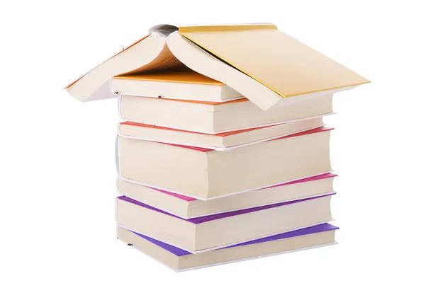 House made with books piled on white background — Stock Photo, Image