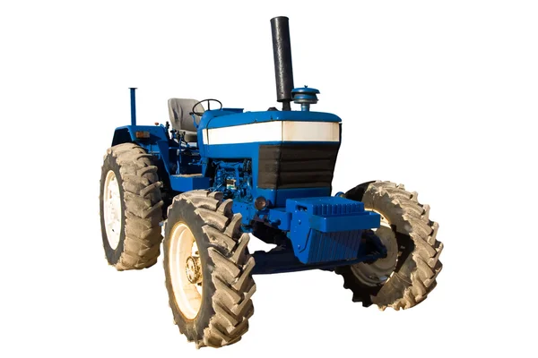 Alter blauer rostiger Traktor mit schmutzigen Rädern — Stockfoto