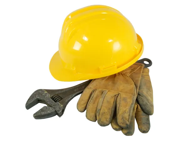 Yellow hardhat, old leather gloves and wrench isolated on white background — Stock Photo, Image