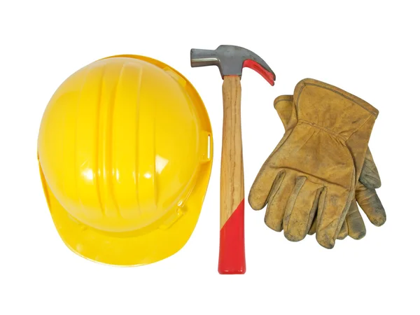 Sombrero amarillo, guantes de cuero viejos y un martillo aislado sobre fondo blanco —  Fotos de Stock