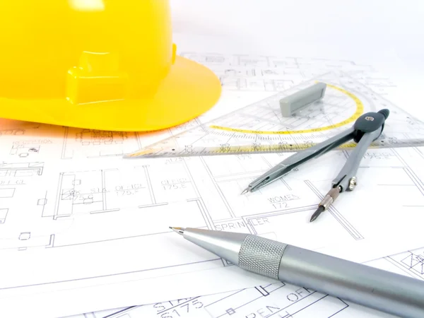 Building projects with architect drawing and protective tools — Stock Photo, Image