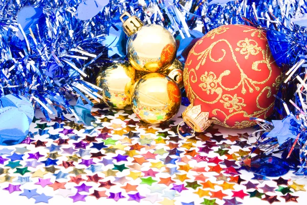 Christmas background with balls, ribbons and confettis — Stock Photo, Image