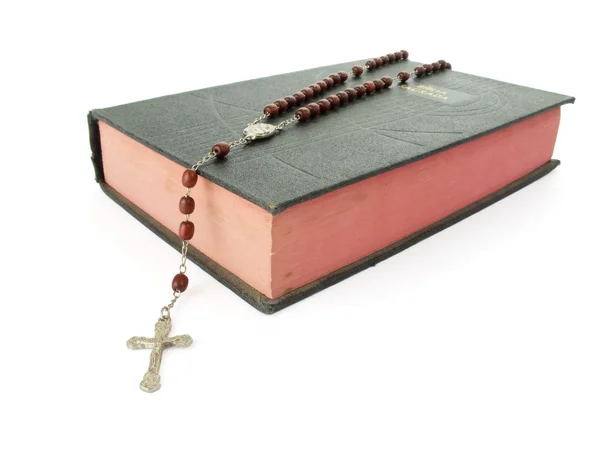 Rosary over an old holy bible — Stock Photo, Image