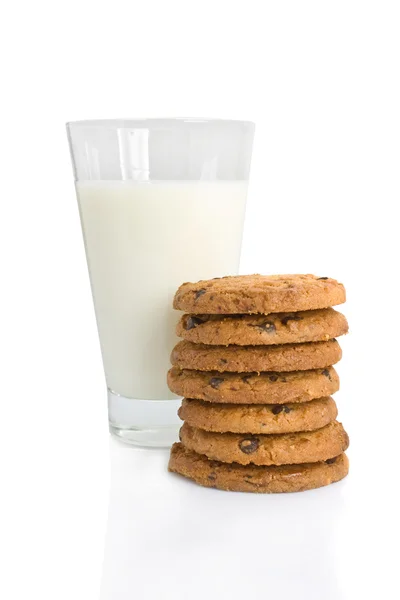 Chocolate chip cookies and a glass of milk isolated on white Royalty Free Stock Images