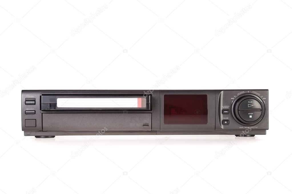 Old Video Cassette Recorder ejecting tape isolated on white background