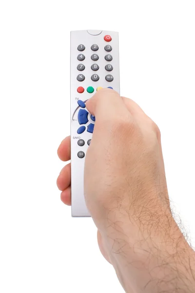 Χέρι που κρατά το τηλεχειριστήριο της τηλεόρασης απομονωθεί σε λευκό — Φωτογραφία Αρχείου